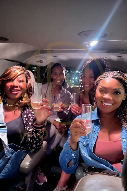 Group of women in a limousine holding champagne