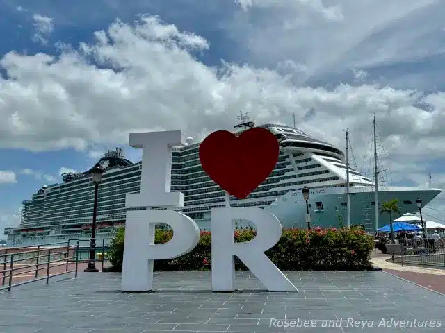 Cruise ship docked at Old San Juan 'I ❤️ PR' sign in the foreground.