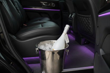 White Sparkling Bottle in Luxury SUV