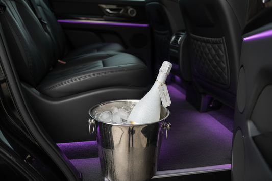 White Sparkling Bottle in Luxury SUV